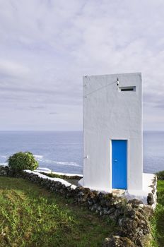 Whale watch tower hanging over the cliff, Pico island, Azores
