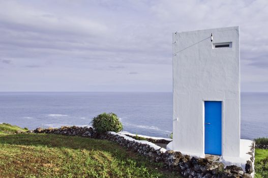 Whale watch tower hanging over the cliff, Pico island, Azores
