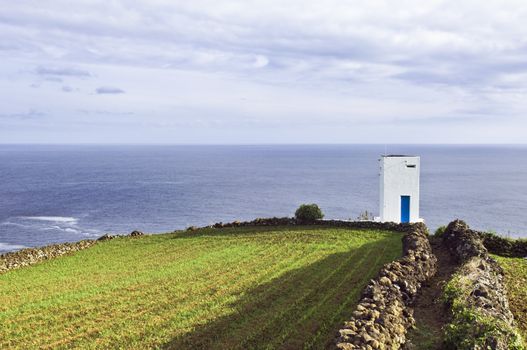 Whale watch tower hanging over the cliff, Pico island, Azores
