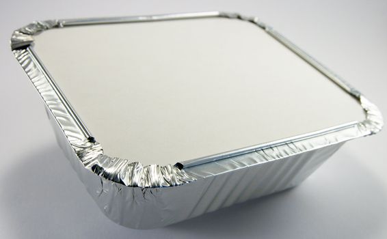 Square silver foil tray with lid on a white background