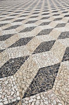 Nice geometric decorative stone pavement traditional from Portugal
