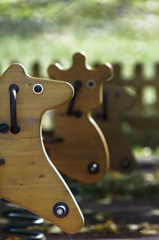 Horse shaped swing detail in the afternoon light
