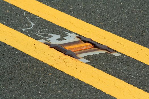 A Road reflector lane marker in the street