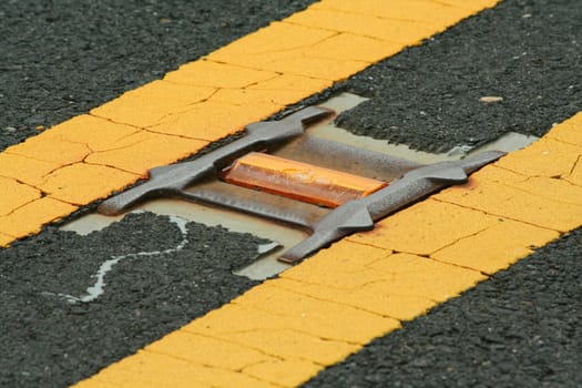 A Road reflector lane marker in the street