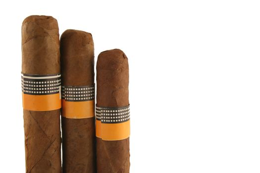 Three isolated cigars on white background