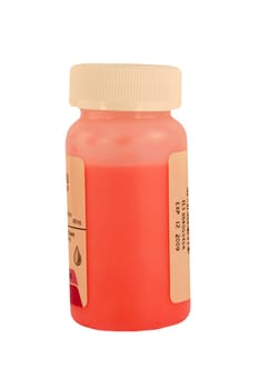A Isolated childrens pink medicine bottle