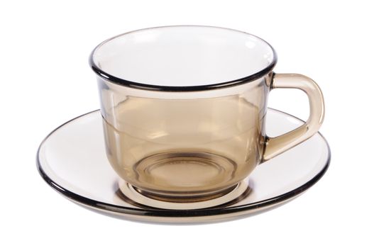 empty transparent cup and saucer on white