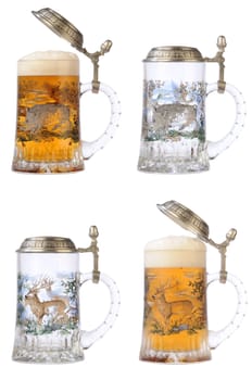 Souvenir glass with the image of the wild nature, filled by beer, with the slightly opened cover