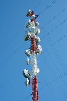 A Microwave tower against a blue sky