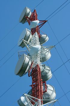 A Microwave tower against a blue sky