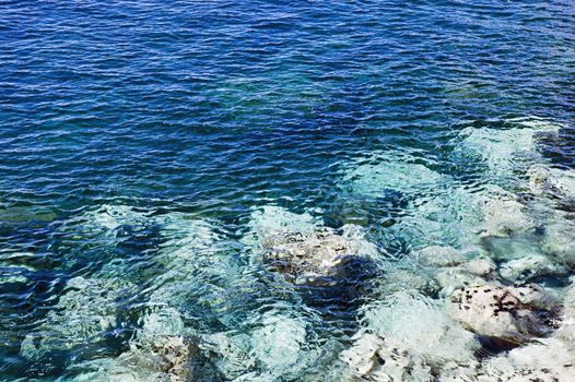 Calm water surface detail rippled by the wind.