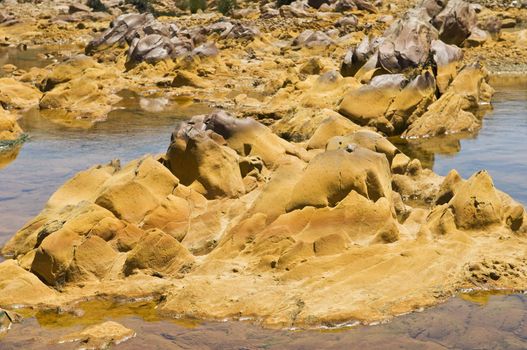 Polluted river by contaminated water of a mine runoff
