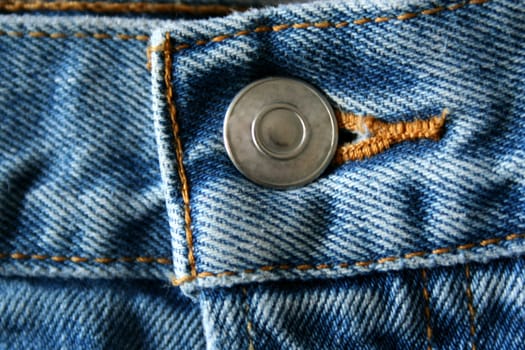 A close up of a Blue Jeans Button