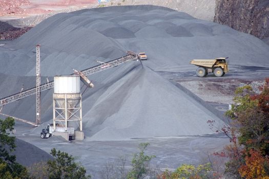 A Rock Quarry with tower and truck