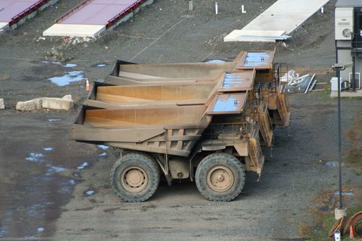 Three large quarry truck in a row