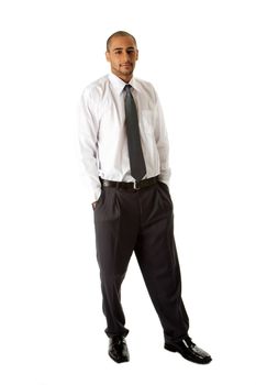 Handsome African Hispanic business man in white shirt, gray pants and tie, standing with hands in pocket, isolated