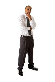 Handsome African Hispanic business man in white shirt, gray pants and tie, standing with hands on chin thinking, isolated