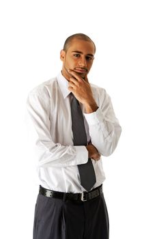 Handsome African Hispanic business man in white shirt, gray pants and tie, standing with hands on chin thinking, isolated