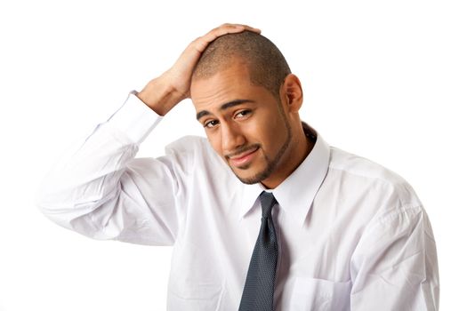 Torso of a handsome African Hispanic business man in white shirt and gray tie and hand on top of head, isolated