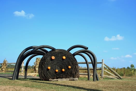 A Black Spider made from a hay bail