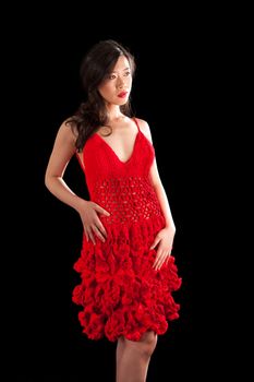 Beautiful sexy Asian woman in a crochet red dress, isolated