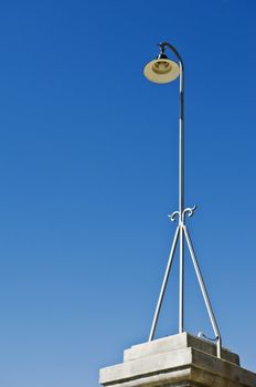 Retro streetlight against a clear blue sky

