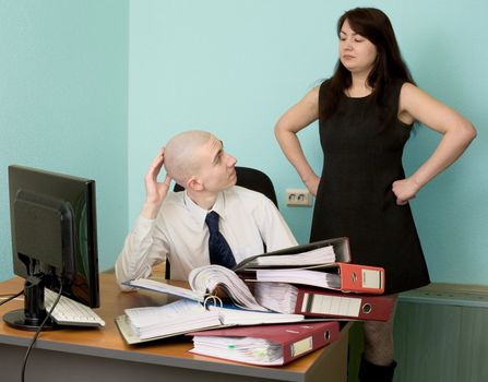 The bookkeeper and the secretary on a workplace at office