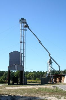 A Peanut Processing Plant against a blue sky