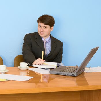 Business team sits at the big table