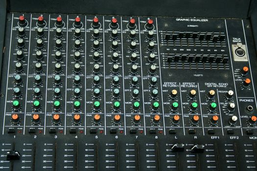 a close up of a Music Mixing Board