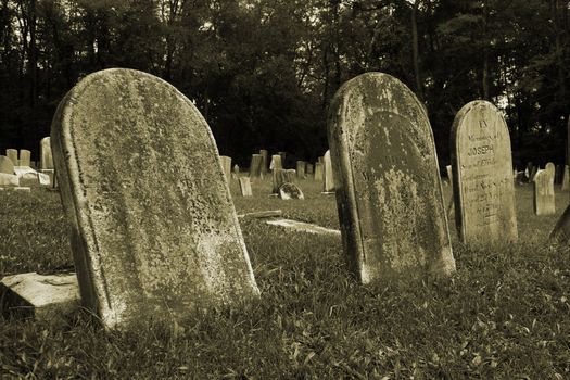 Old Gravestones with grass in a graveyard
