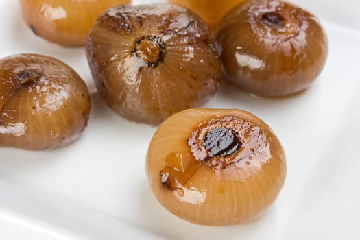 pickeled onions on a white plate