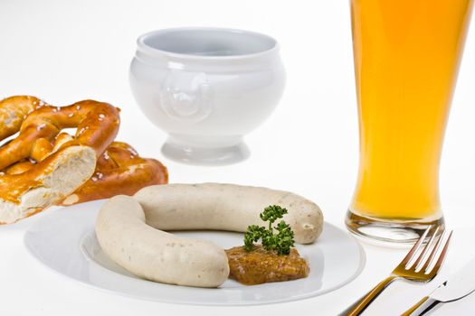 bavarian white sausage, wheat beer and pretzel