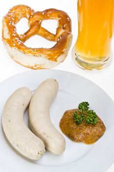 bavarian white sausage, wheat beer and pretzel