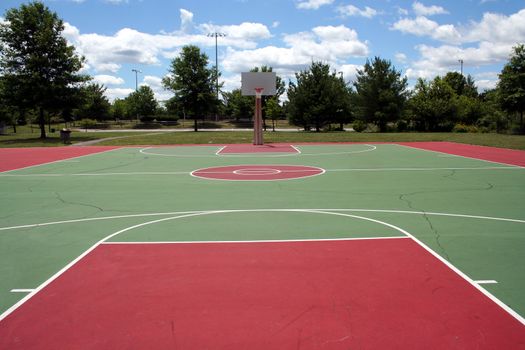 an image of a Basketball court against a cloudy sky