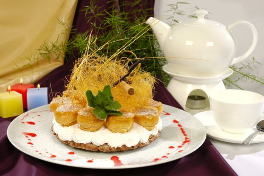 cream pastries as cake, decorated the crushed and saccharine straw