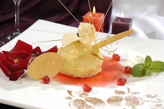 Waffle dessert with caramel, decorated with rose petals and mint