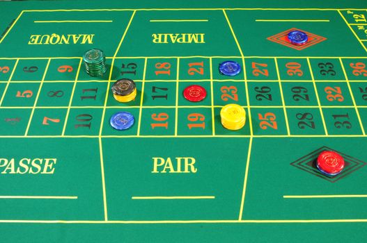 Casino chips on green felt