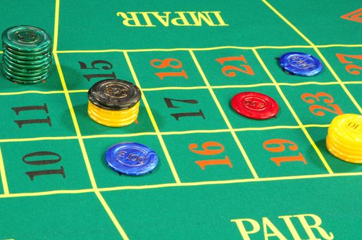 Casino chips on green felt