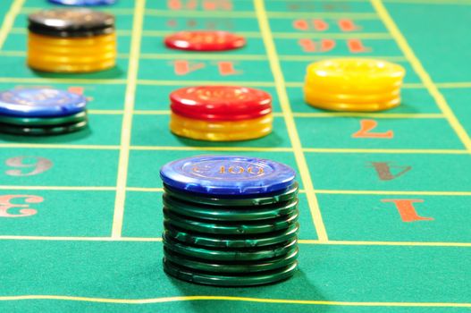 Casino chips on green felt