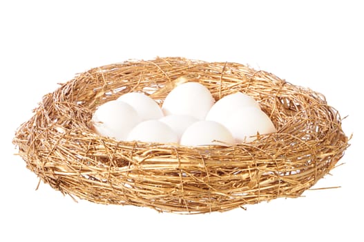 white eggs in golden nest