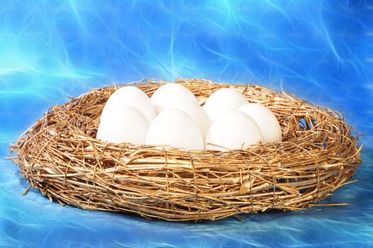 white eggs in golden nest on mystic blue background