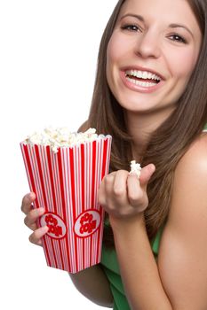 Pretty smiling girl eating popcorn