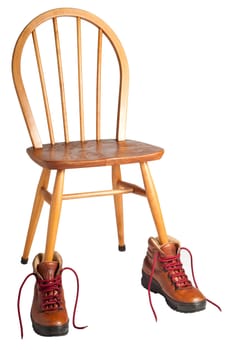 Wooden chair wearing leather hiking boots