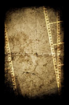 An old film frame on an old grunge paper