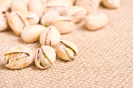 healthy nuts pistachios on a burlap canvas shallow depth of view