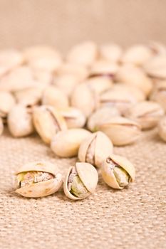 healthy nuts pistachios on a burlap canvas shallow depth of view