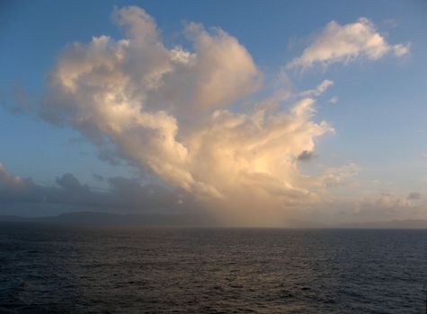 This image is showing Samana, Dominican Republic in the distant background, with a lovely cloud bank as the sun was setting