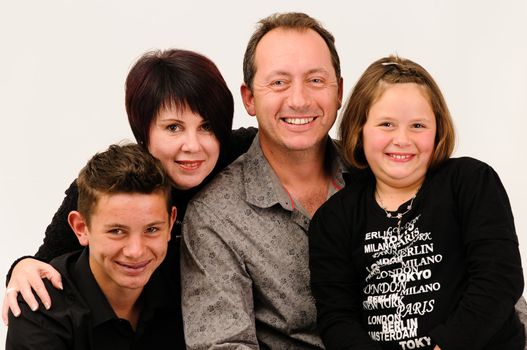 a young good looking family with sexy teenage children smiling