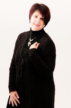 Beautiful attractive fuller figure mature short haired woman with hand on shoulder dressed in black knitted jacket